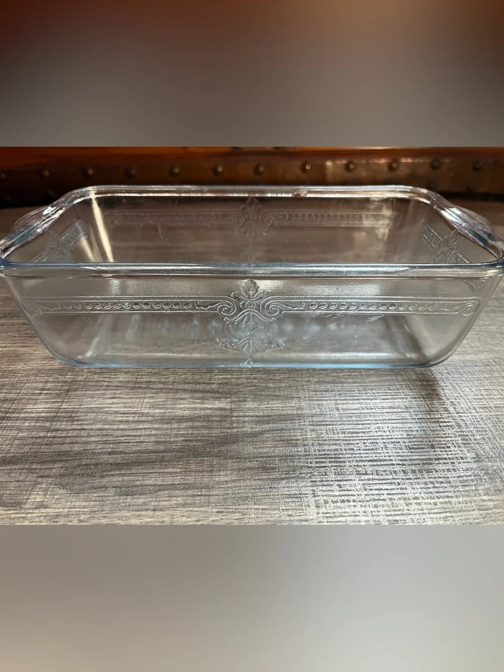 Beautiful Fire King loaf pan. Decorative. Chip on outside and rim. See photos